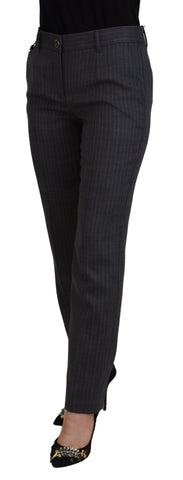 Gray striped wool tapered women's pants by Dolce & Gabbana arranged flat showing the tailored fit and pattern details.