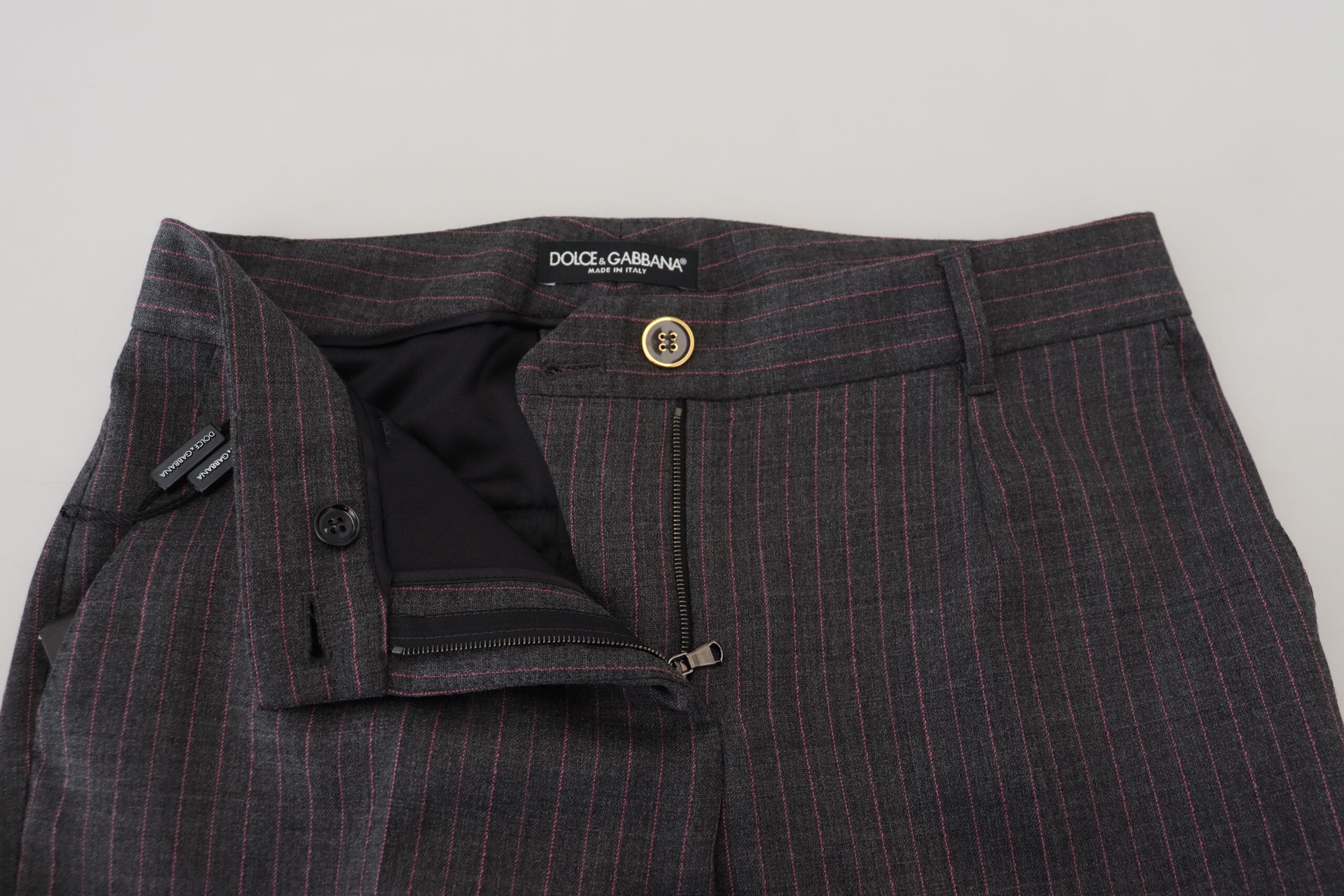 Gray striped wool tapered women's pants by Dolce & Gabbana, showing the fitted waist and tapered leg design.