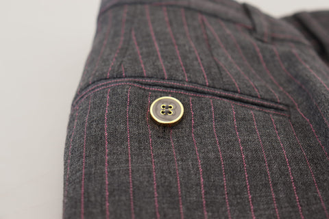 Gray striped wool tapered women's pants by Dolce & Gabbana, showing the fitted waist and tapered leg design.