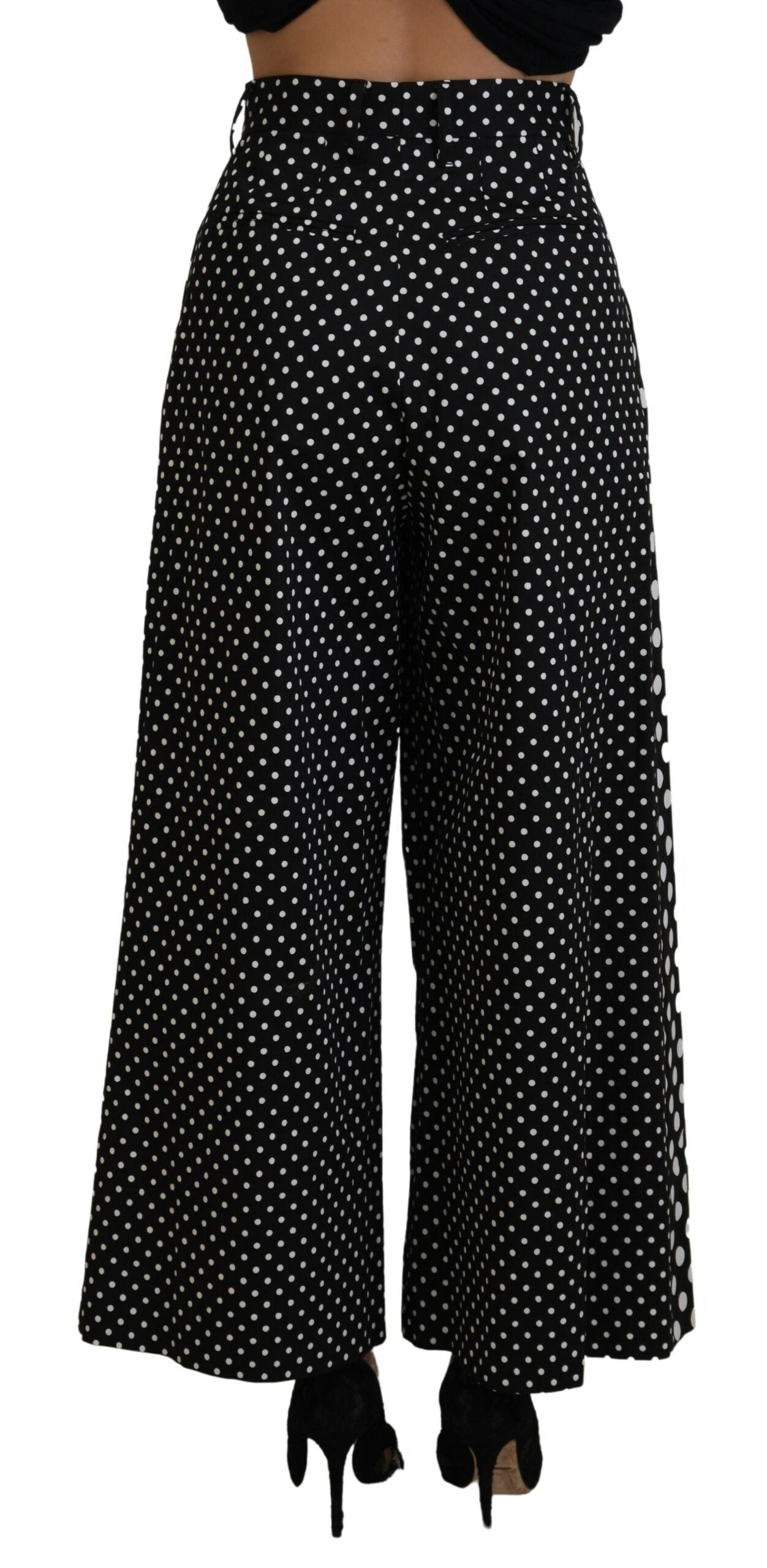 Multicolor polka dot high waist pants by Dolce & Gabbana shown on a model. Elegant, vibrant design with a high waist fit.