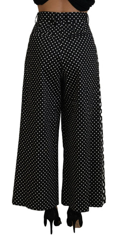 Multicolor polka dot high waist pants by Dolce & Gabbana shown on a model. Elegant, vibrant design with a high waist fit.