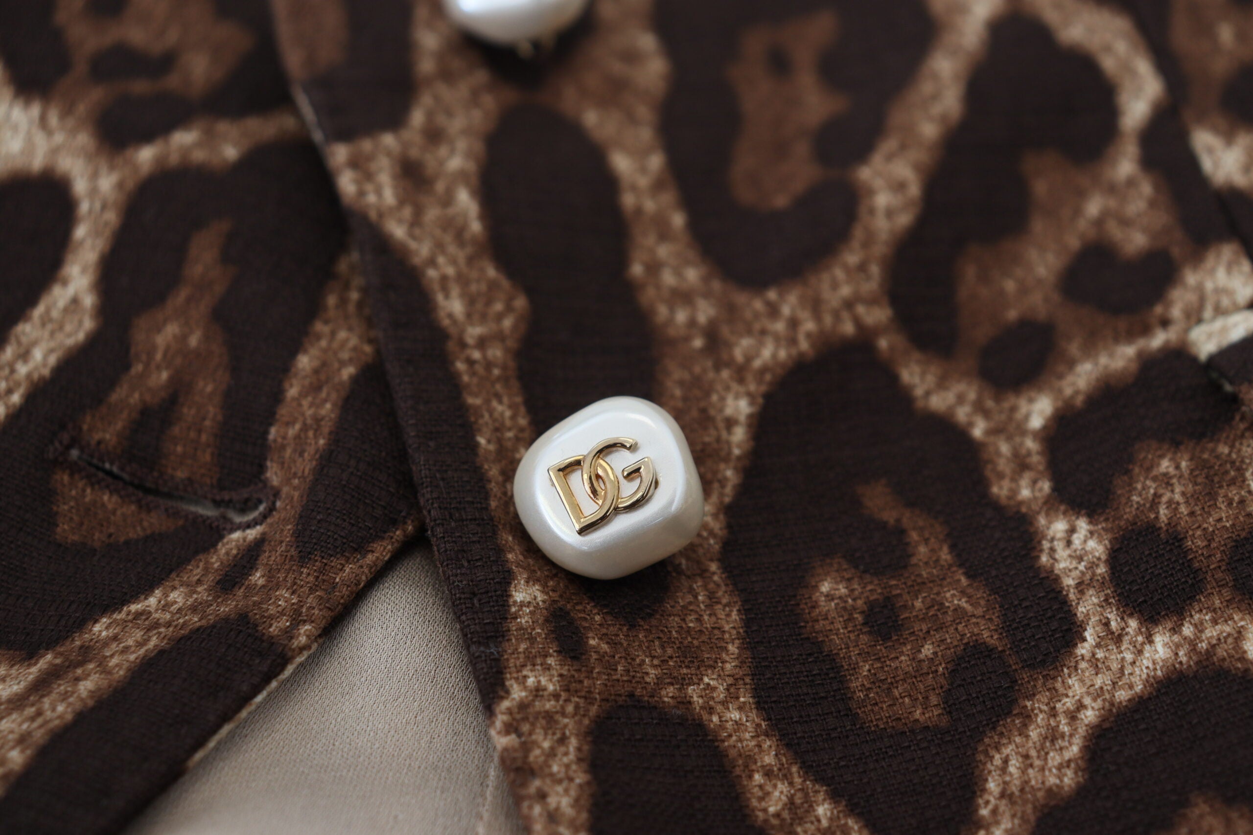 Brown leopard print wool A-line mini skirt by Dolce & Gabbana, featuring a stylish, fitted design and classic animal pattern.