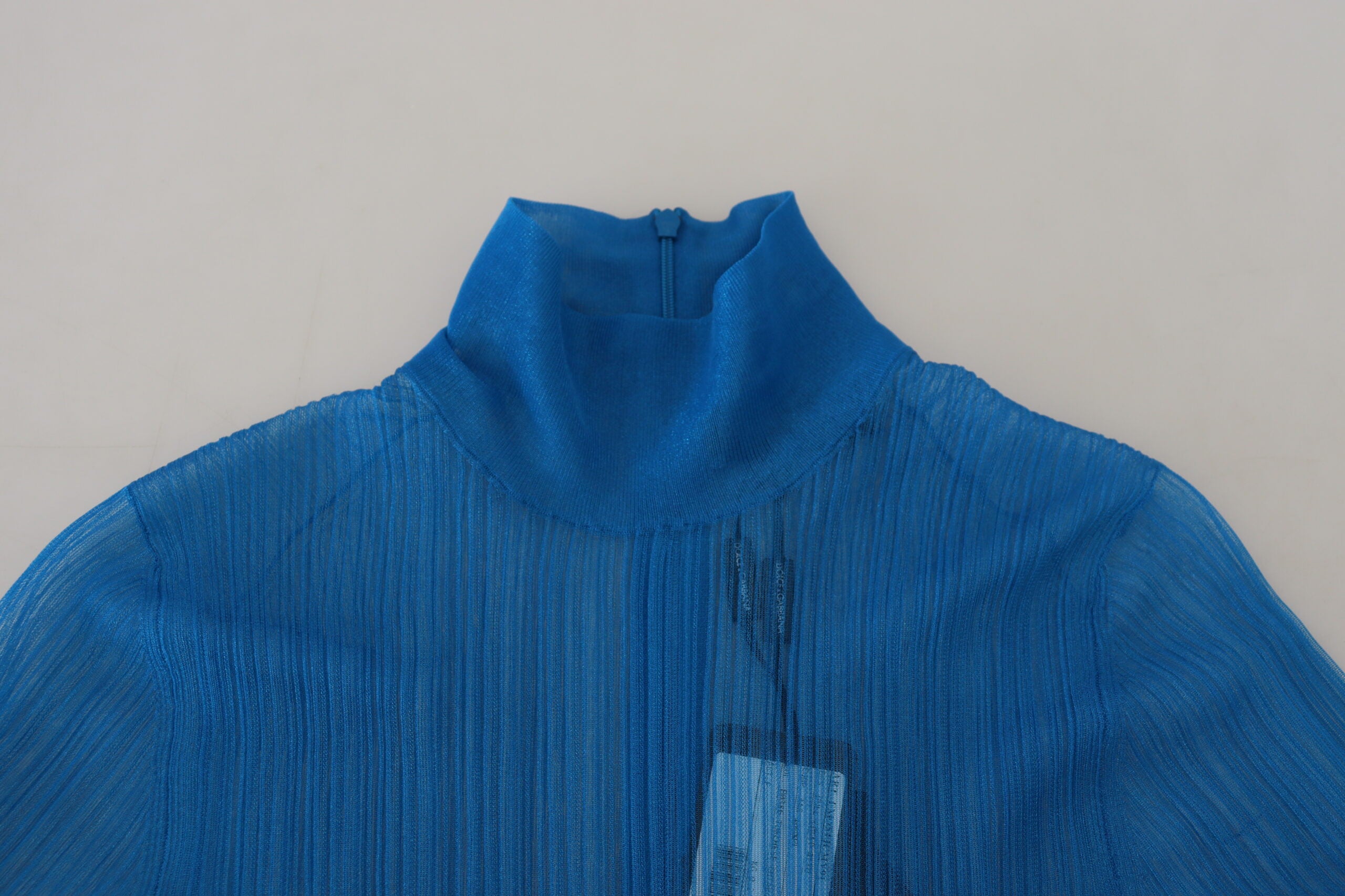Blue mesh turtleneck long sleeve blouse top by Dolce & Gabbana, featuring a fitted design and stylish ribbed texture.