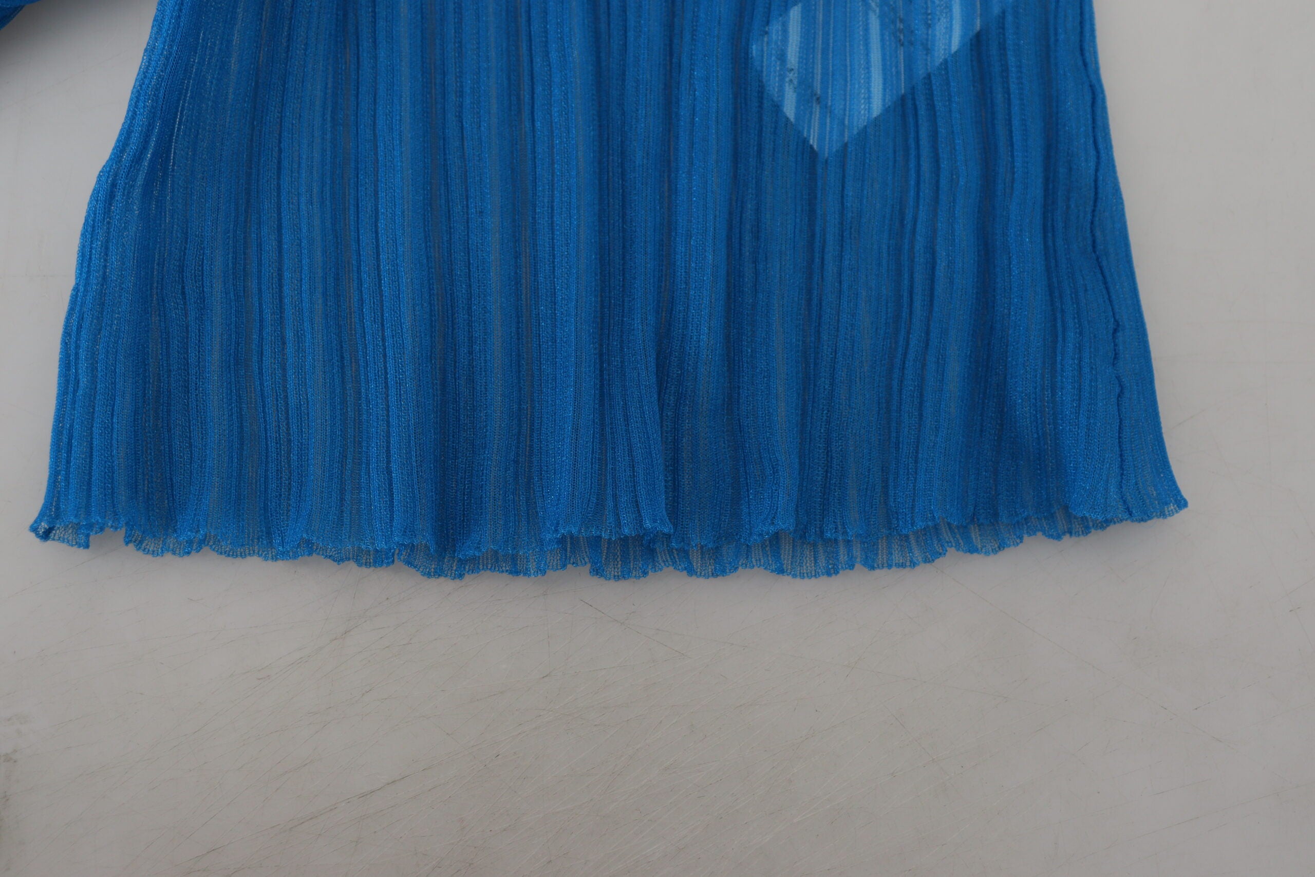 Blue mesh turtleneck long sleeve blouse by Dolce & Gabbana, featuring a fitted design and stylish sheer fabric.