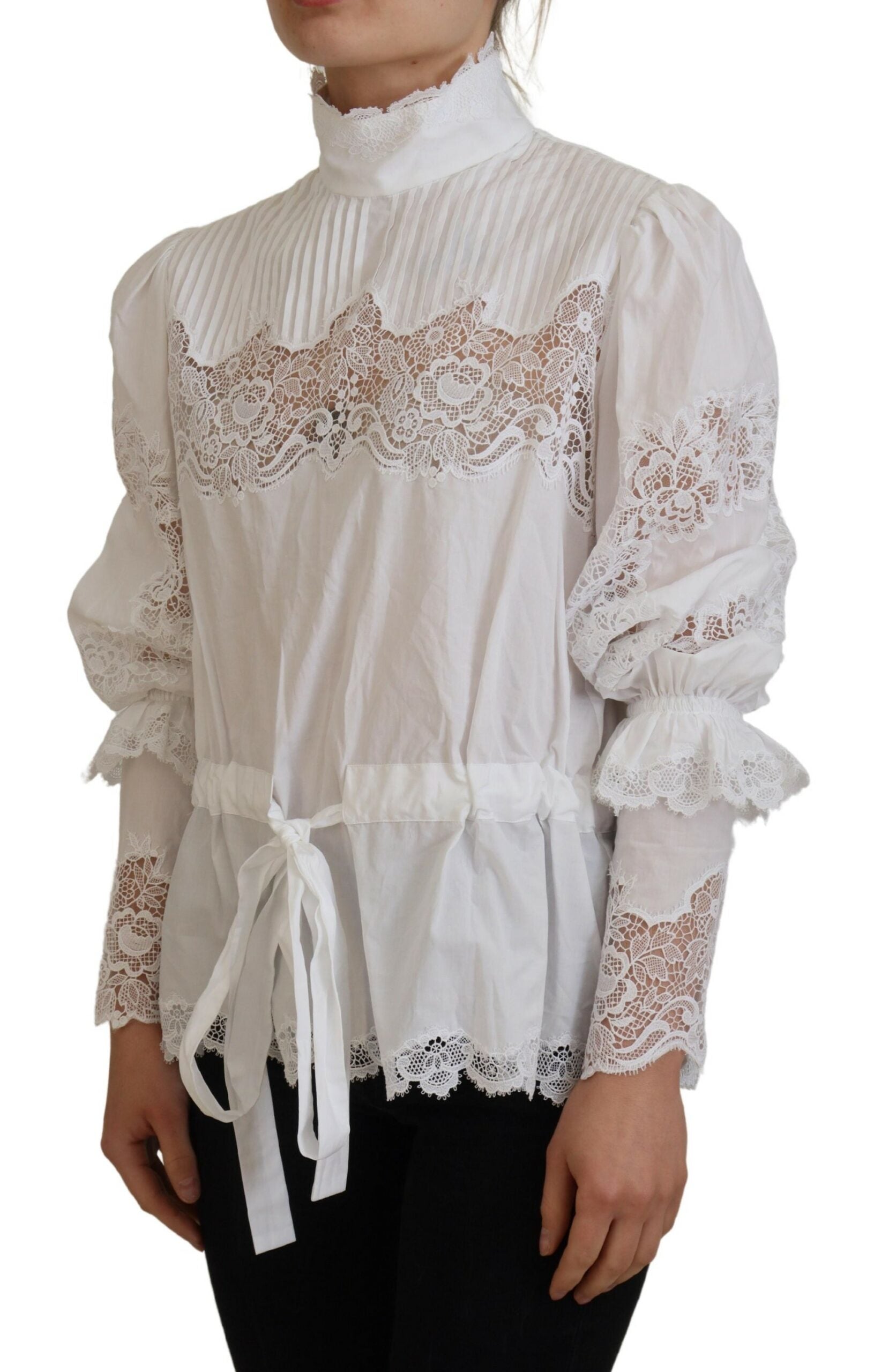 White cotton blouse with lace trim and turtle neck, stylish top by Dolce & Gabbana, shown on a hanger.