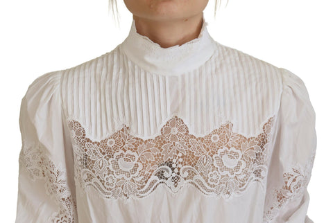 White cotton lace trim turtle neck blouse by Dolce & Gabbana, featuring delicate lace details and a classic fit.
