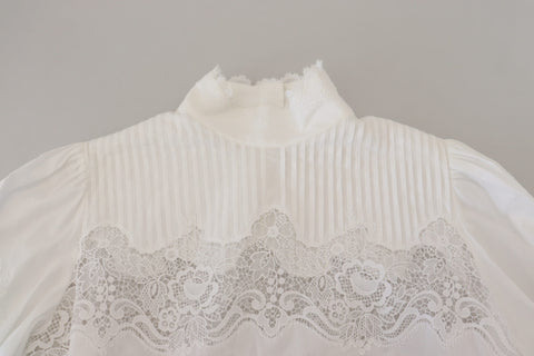 White cotton blouse with lace trim and turtle neck by Dolce & Gabbana, featuring a stylish, elegant design.