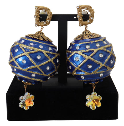 Gold brass dangle earrings with blue ball and crystal accents, clip-on style by Dolce & Gabbana.