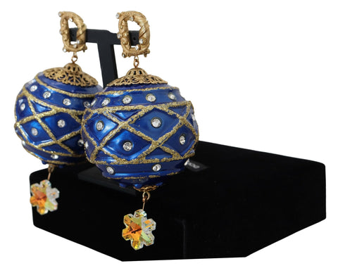 Gold brass and blue dangle ball crystal clip-on earrings by Dolce & Gabbana showing intricate design and sparkling crystal accents.