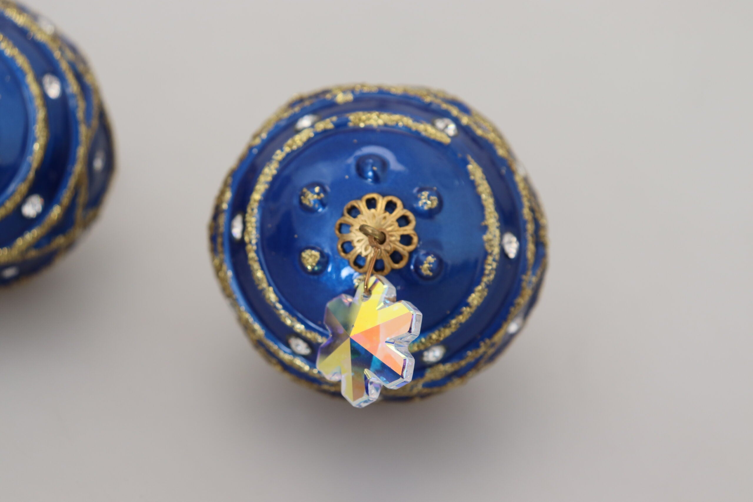 Gold brass and blue dangle crystal clip-on earrings with ball design by Dolce & Gabbana