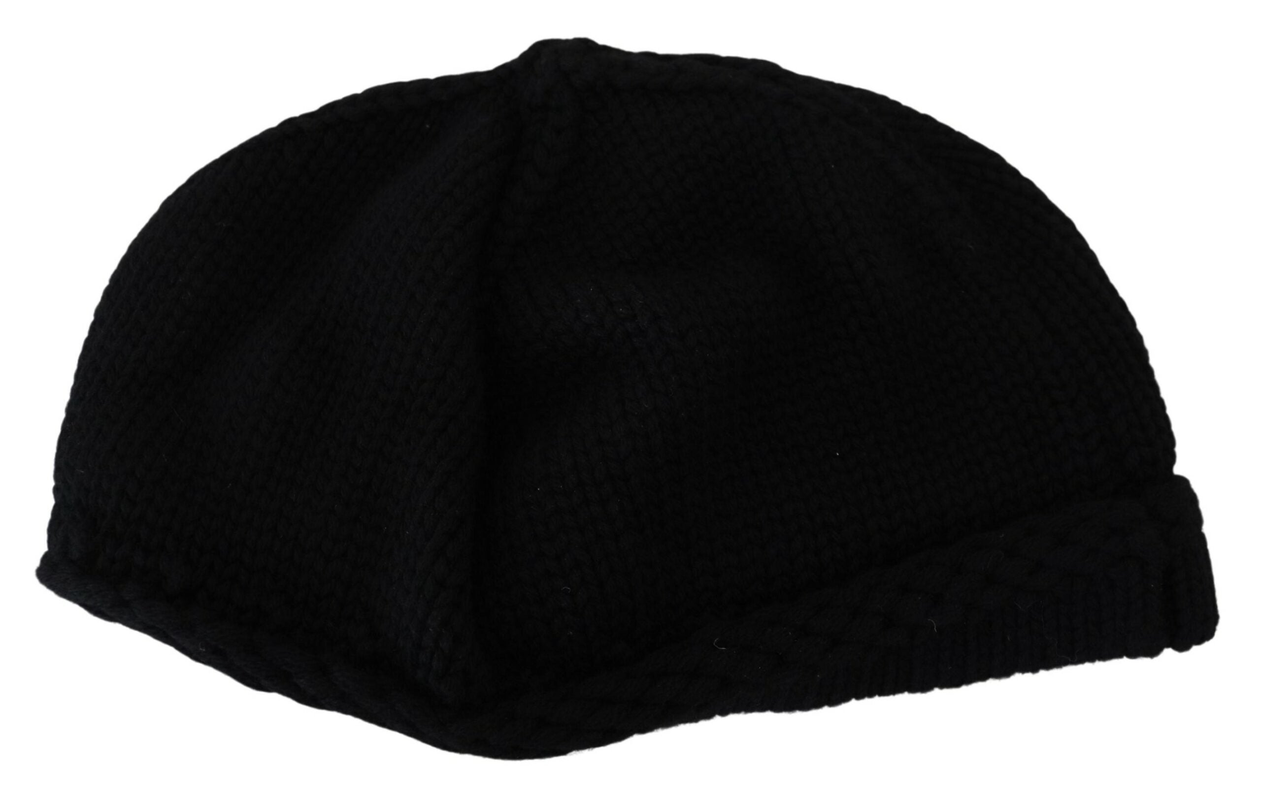 Black Virgin Wool women’s winter beanie cap hat by Dolce & Gabbana, shown on a model, featuring a snug, stylish knit design.