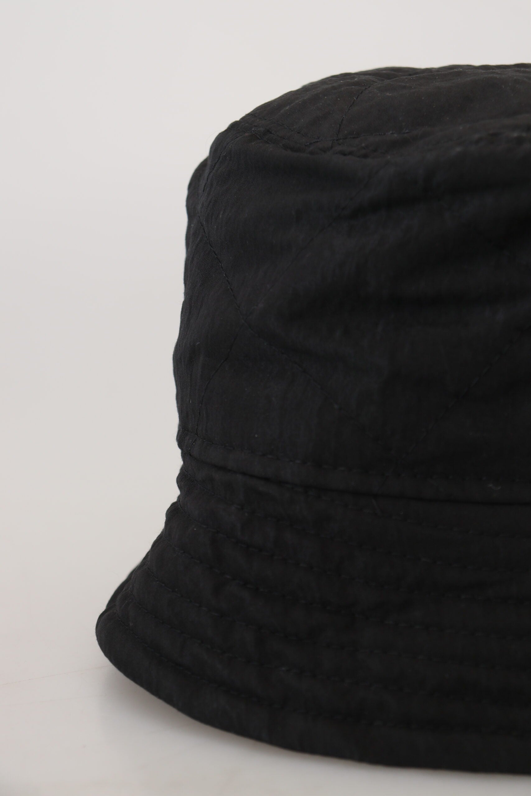Black nylon women's bucket cap hat by Dolce & Gabbana, featuring a stylish wide-brim design and casual fashion look.