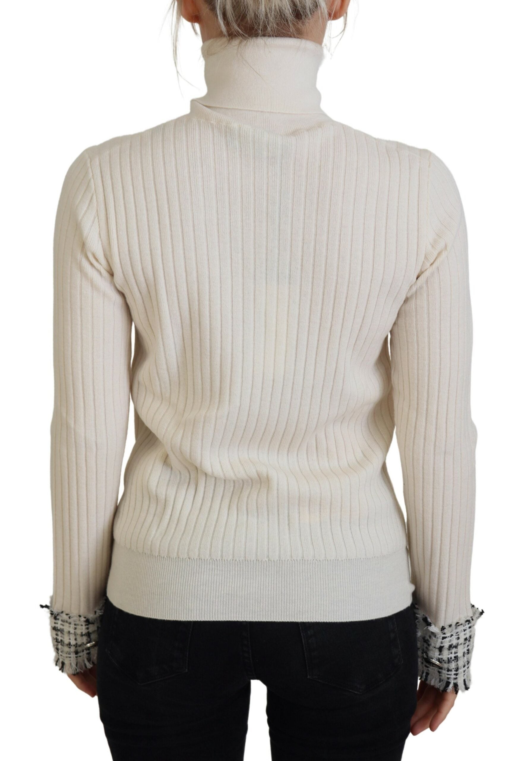 Ivory Dolce & Gabbana turtleneck sweater with distressed cuffs, featuring a cozy pullover design and textured knit fabric.