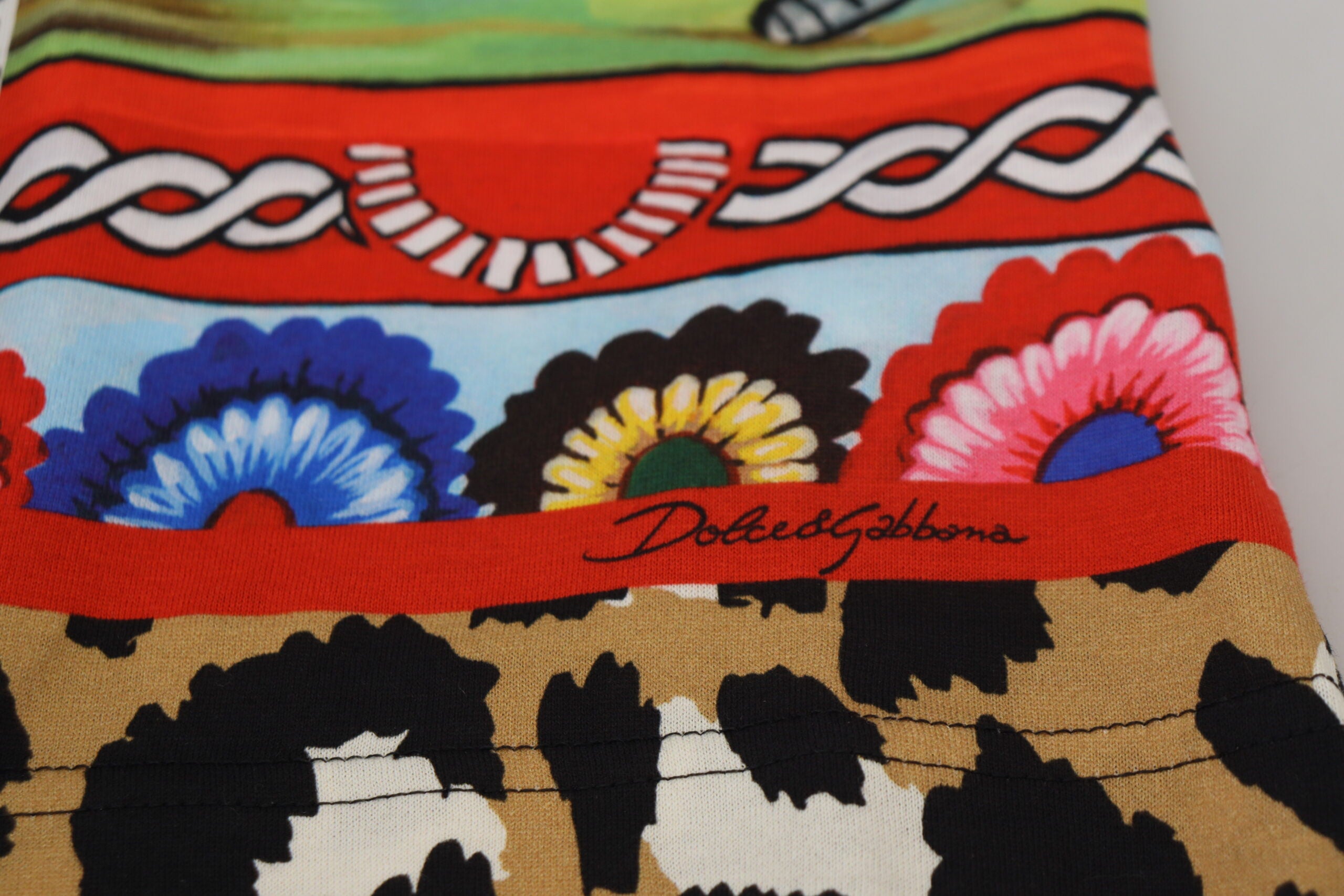 Multicolor printed women's shirt top by Dolce & Gabbana featuring vibrant patterns and a stylish design.