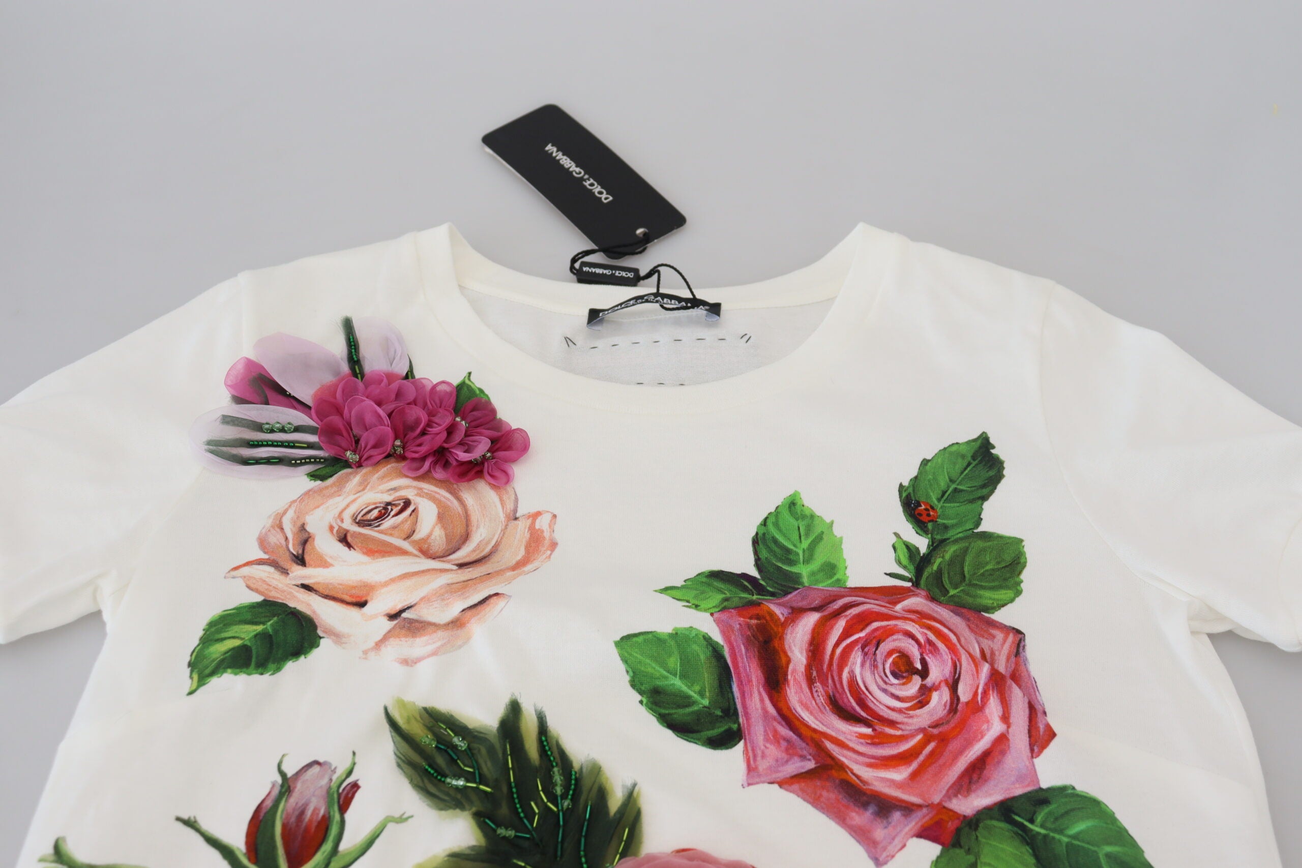 White Dolce & Gabbana short sleeve top with rose DGLogo print, featuring a stylish and casual design.
