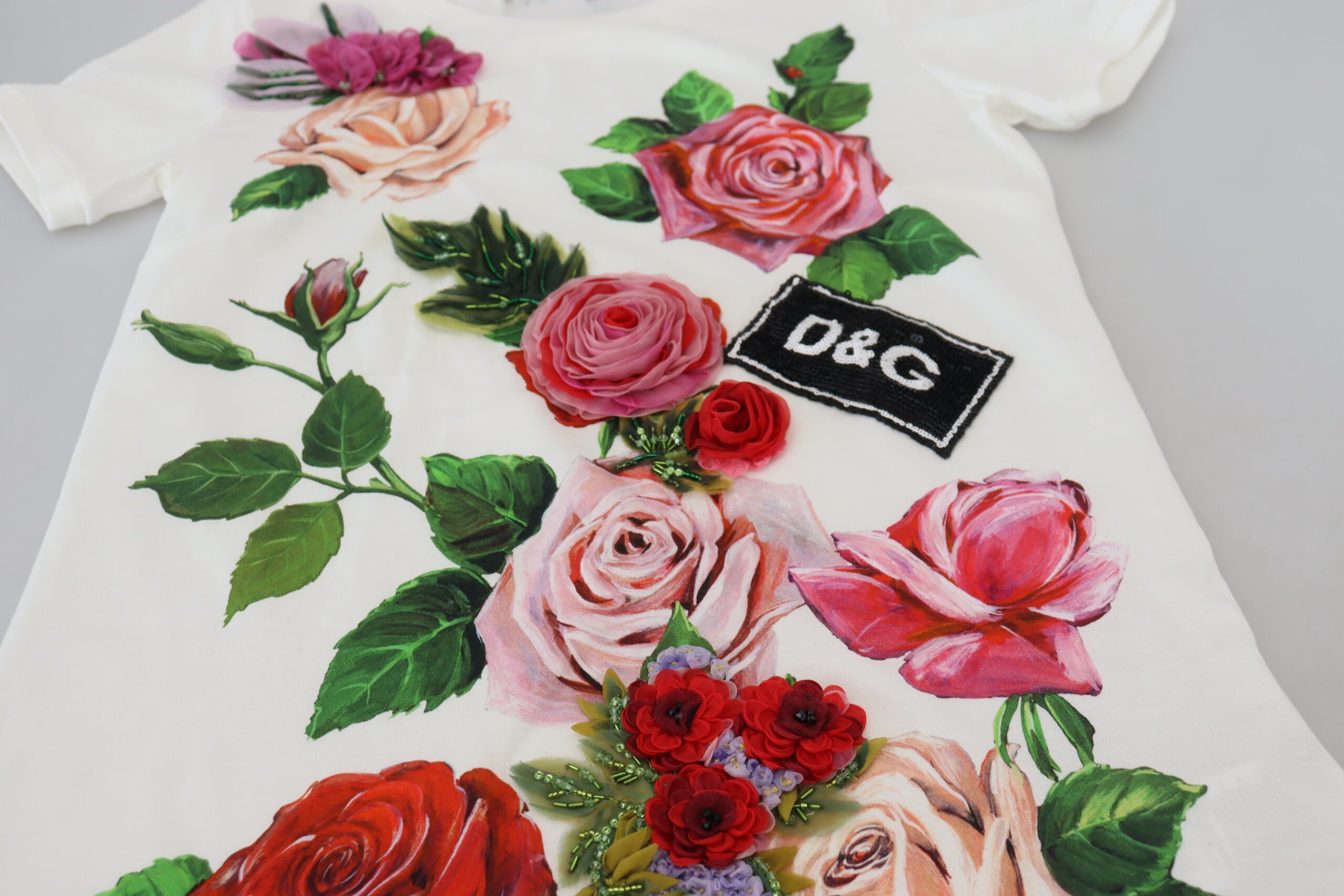White Dolce & Gabbana short sleeve top with rose DGLogo print, casual fashion blouse with floral design.