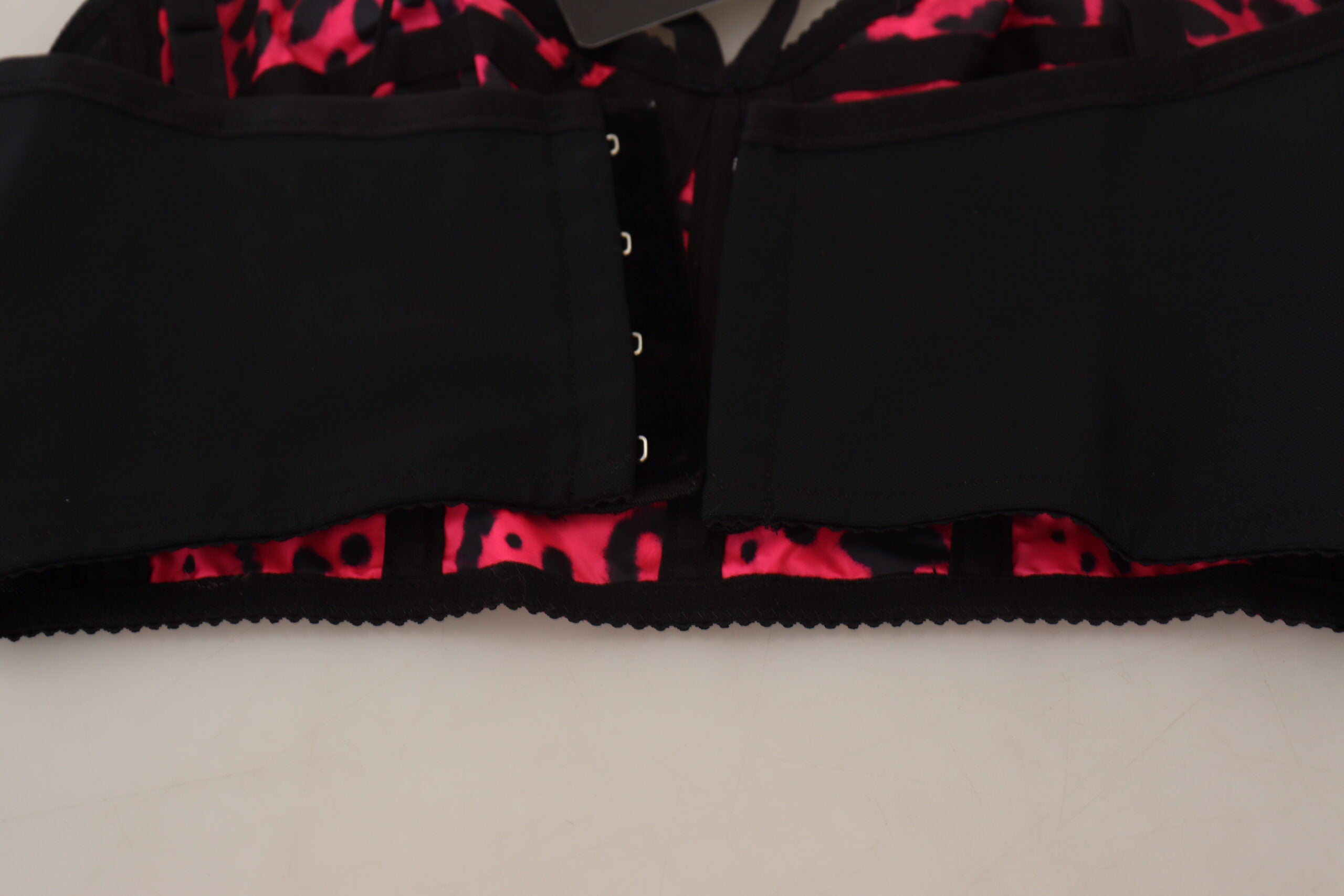 Pink leopard print cropped bustier corset top by Dolce & Gabbana, featuring a fitted design and bold animal print pattern.
