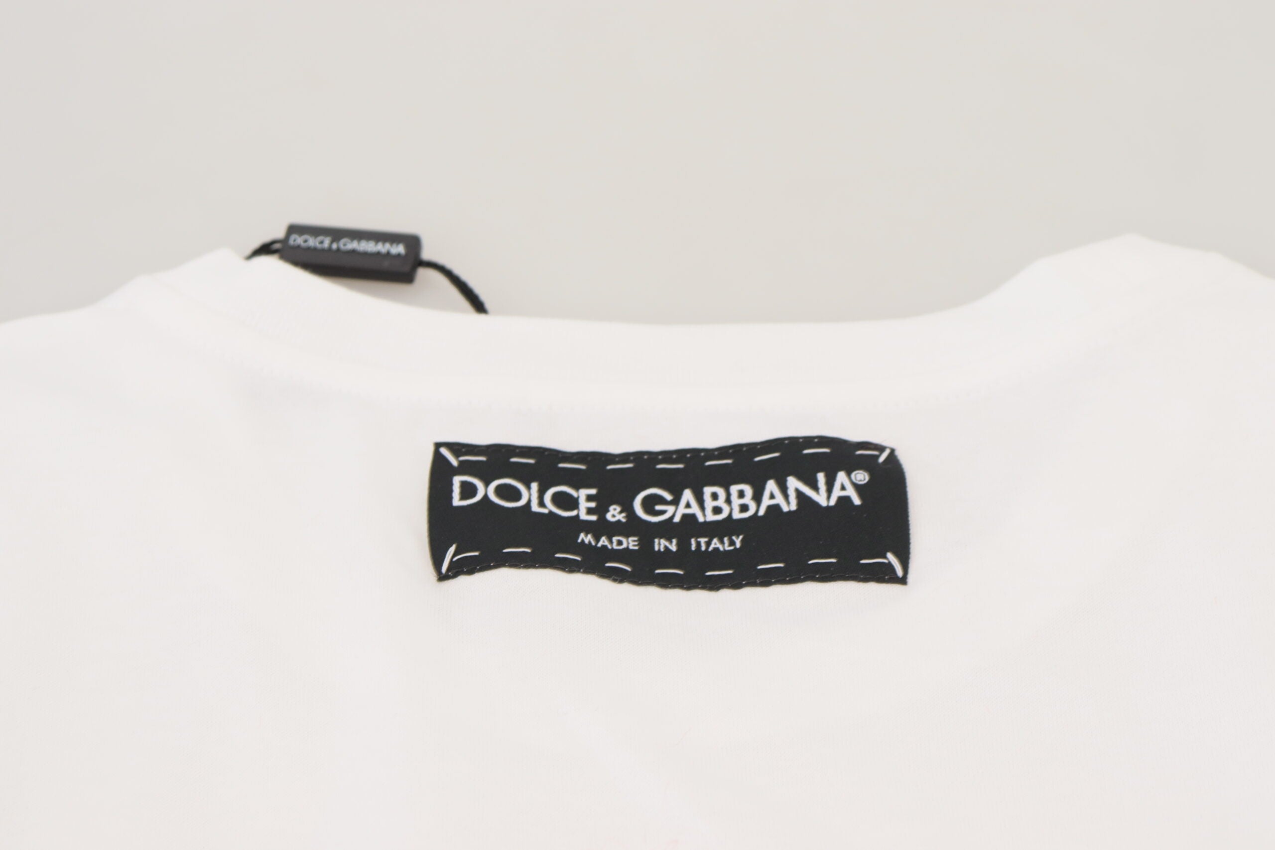 White textured Dolce & Gabbana T-shirt top with short sleeves and printed text design.