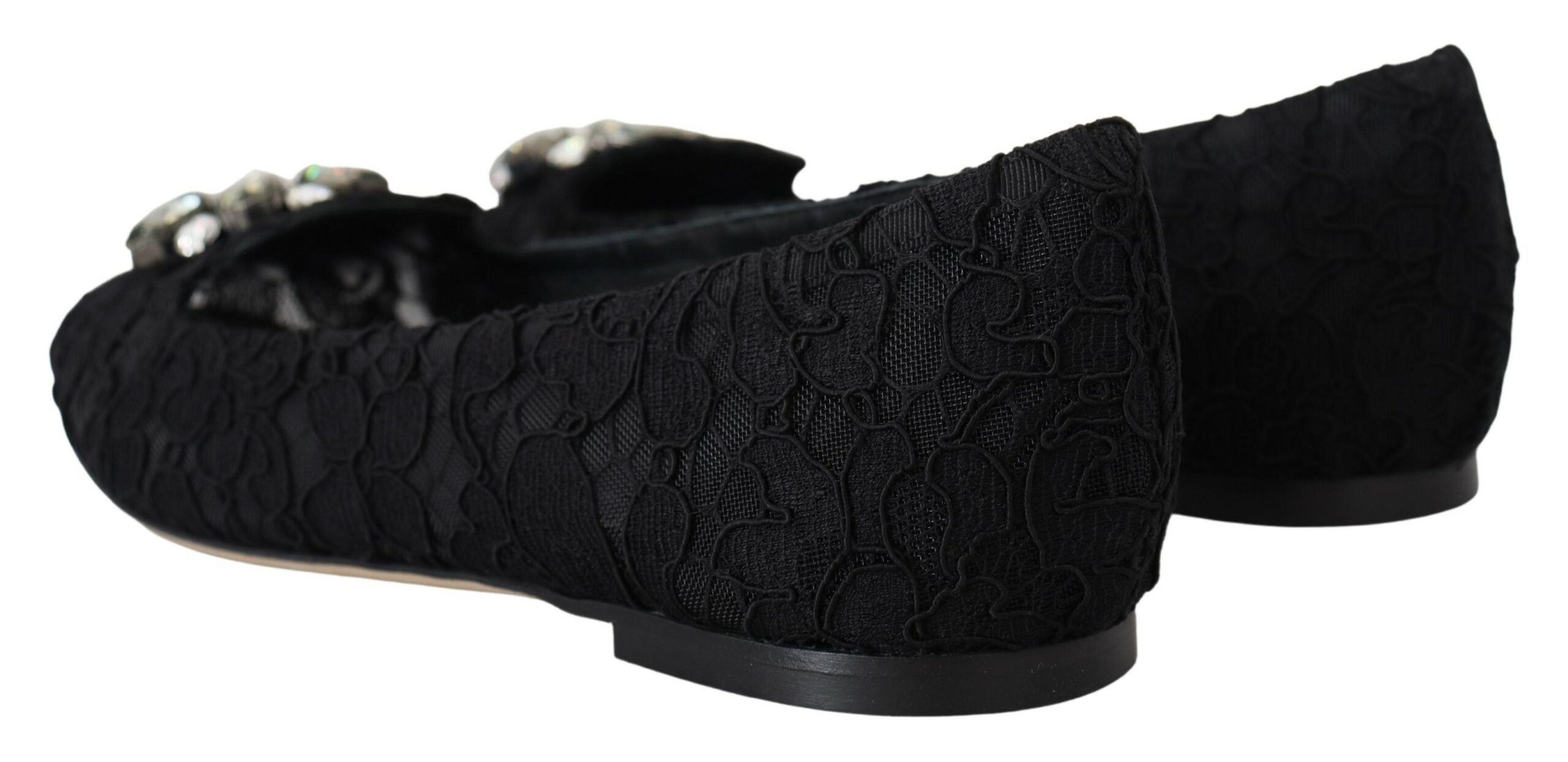Black Taormina lace flats shoes with crystal embellishments by Dolce & Gabbana, featuring a pointed toe and elegant design.