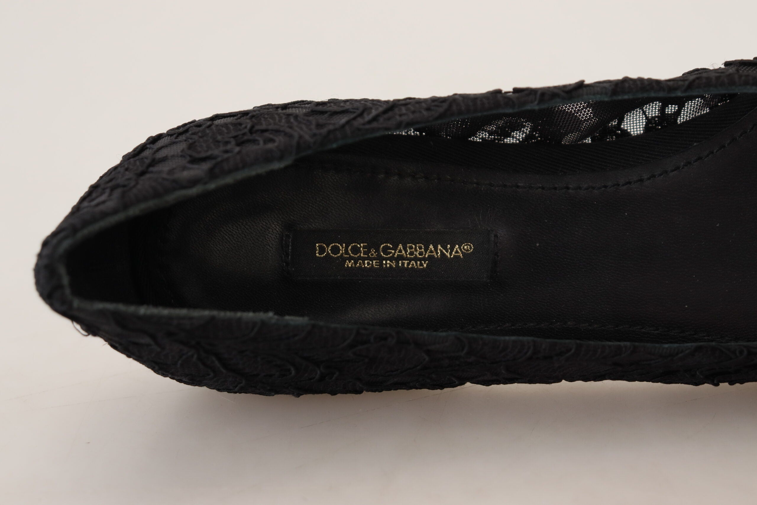 Black Taormina lace flats shoes by Dolce & Gabbana with crystal embellishments and intricate lace detailing.