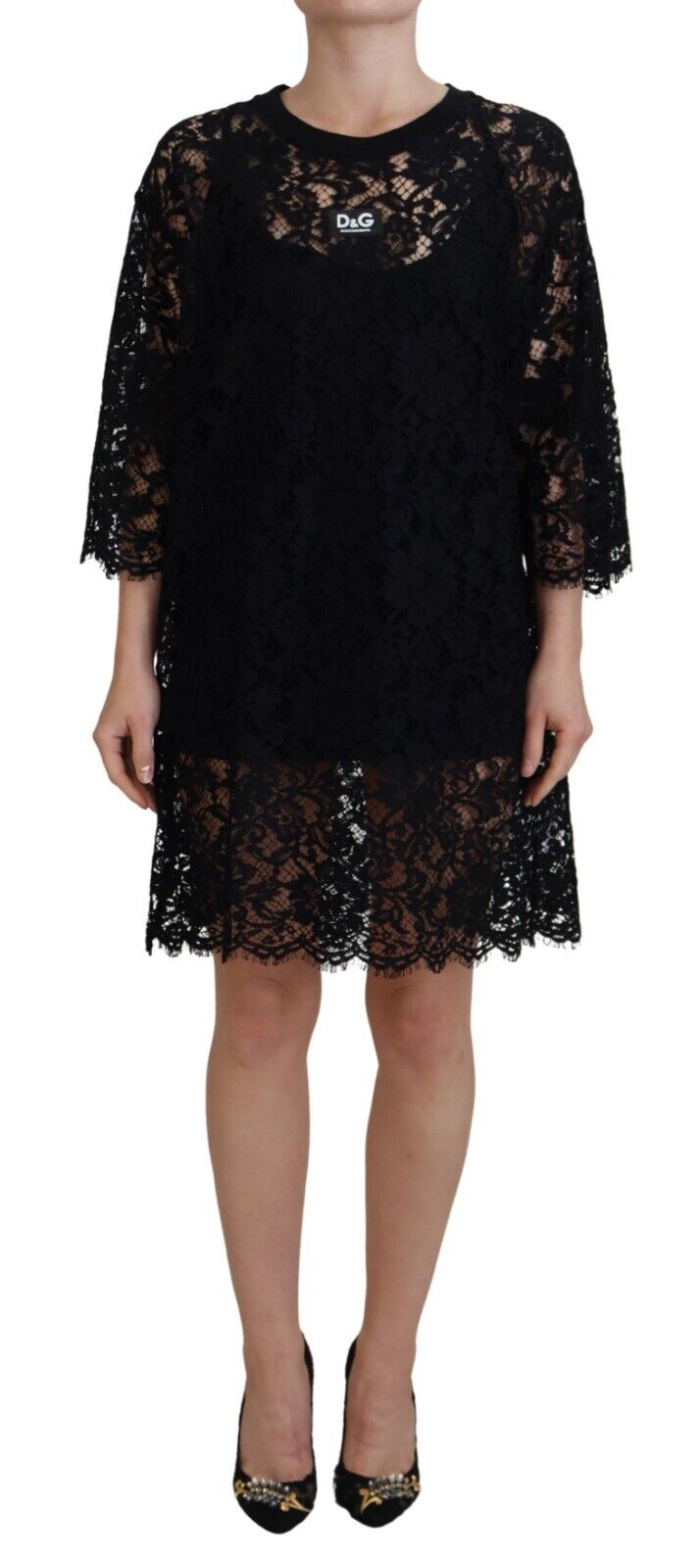 Black floral lace cotton shift mini dress by Dolce & Gabbana, sleeveless with a fitted silhouette and intricate lace detailing.
