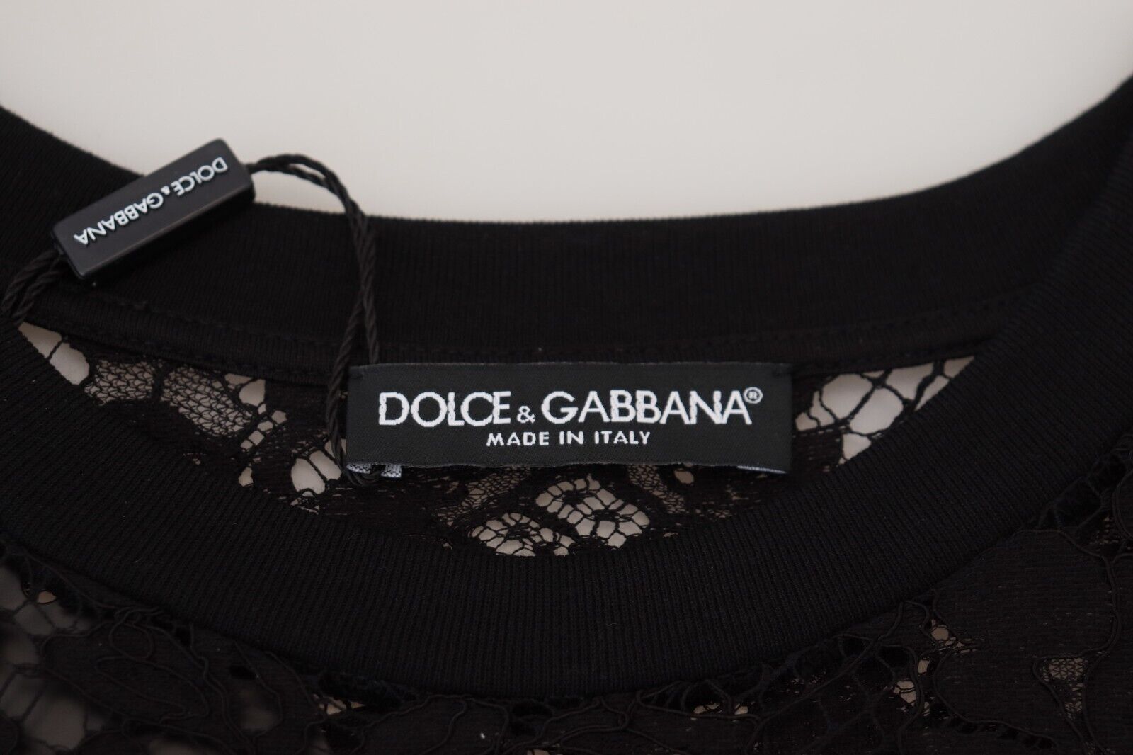 Black floral lace cotton shift mini dress by Dolce & Gabbana, featuring delicate lace details and a fitted silhouette.