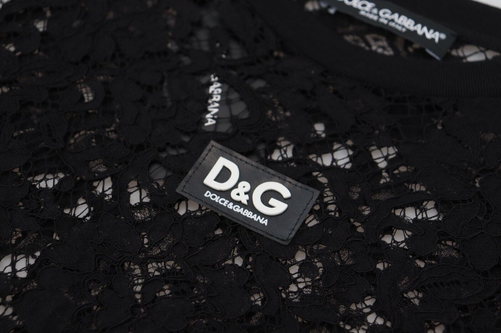 Black floral lace cotton shift mini dress by Dolce & Gabbana, featuring delicate lace details and a fitted silhouette.