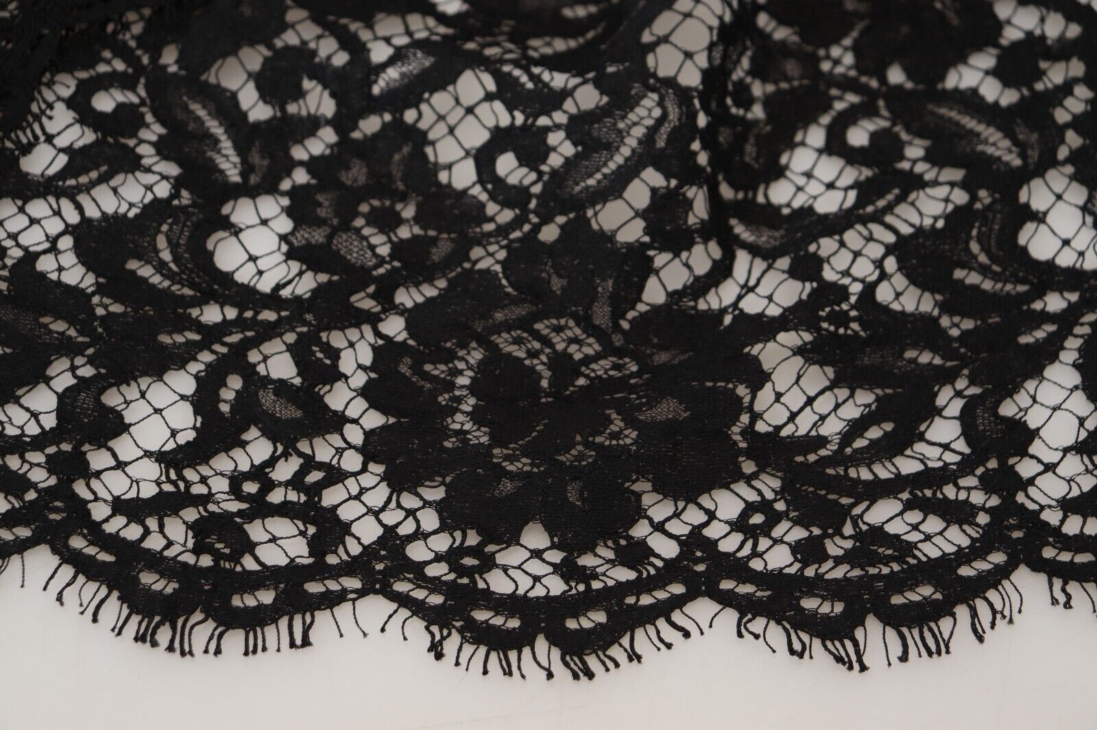 Black floral lace cotton shift mini dress by Dolce & Gabbana, featuring delicate lace details and a sleek silhouette.
