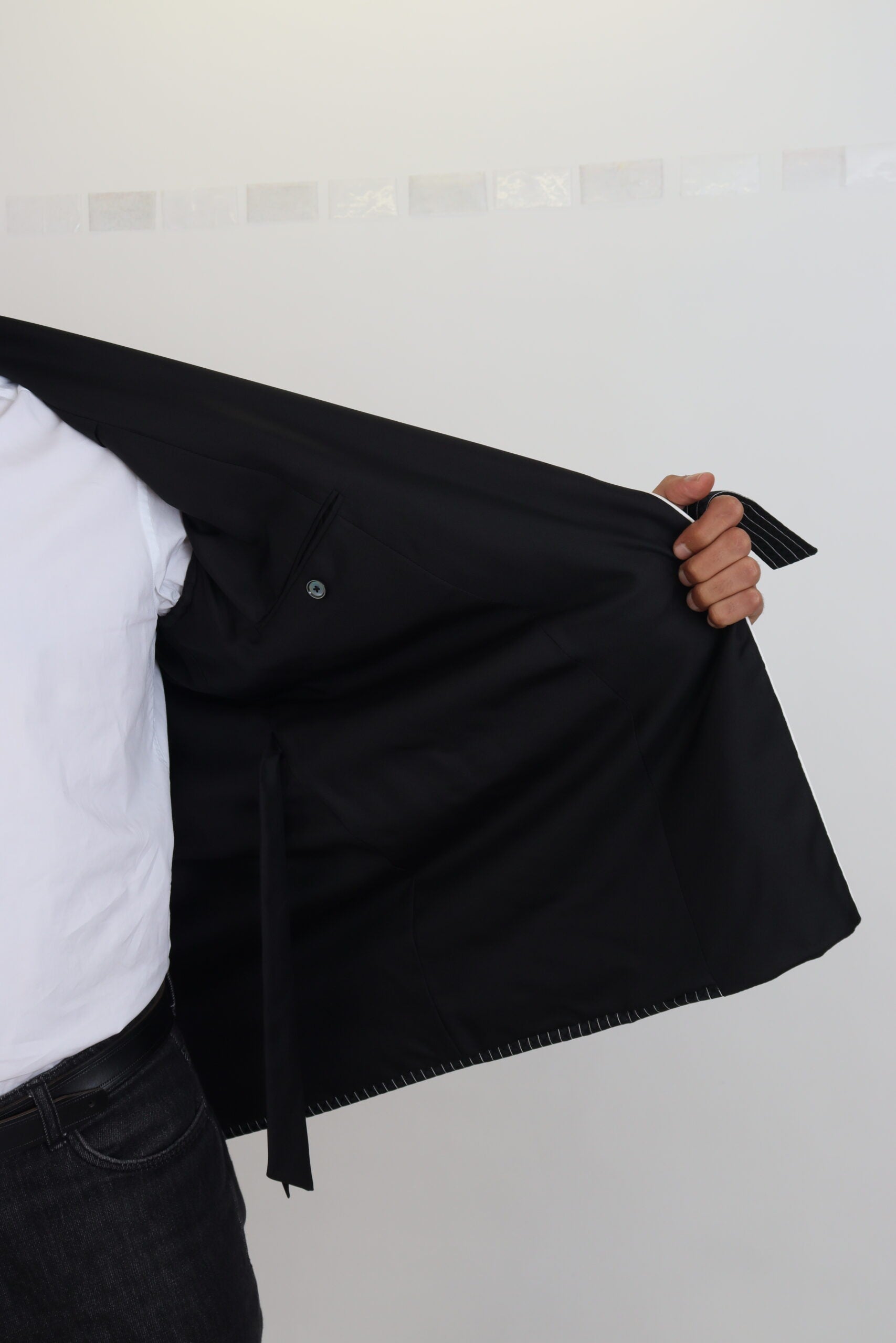 Black striped Dolce & Gabbana patch jacket blazer for men, featuring a tailored fit and stylish design.