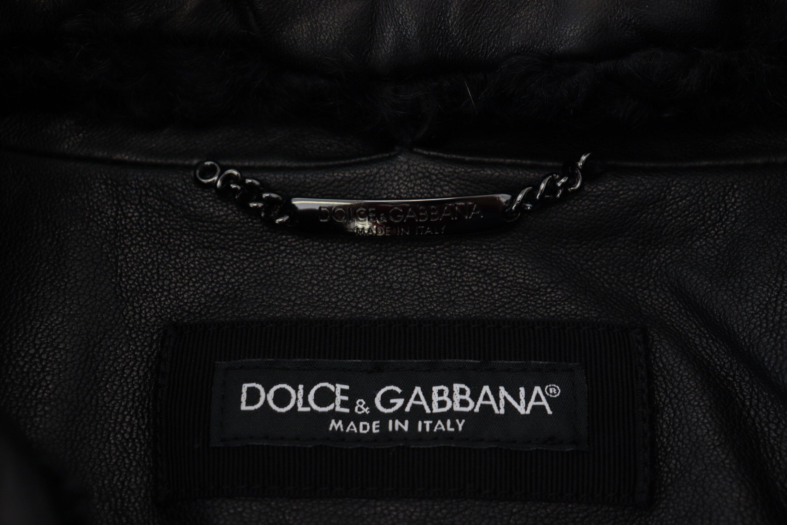 Black lamb leather men's coat with a collared design from Dolce & Gabbana, featuring a sleek, tailored fit and stylish detailing.