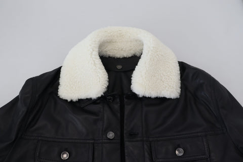Black lamb leather men's coat with a collar, designed by Dolce & Gabbana, shown on a hanger against a neutral background.
