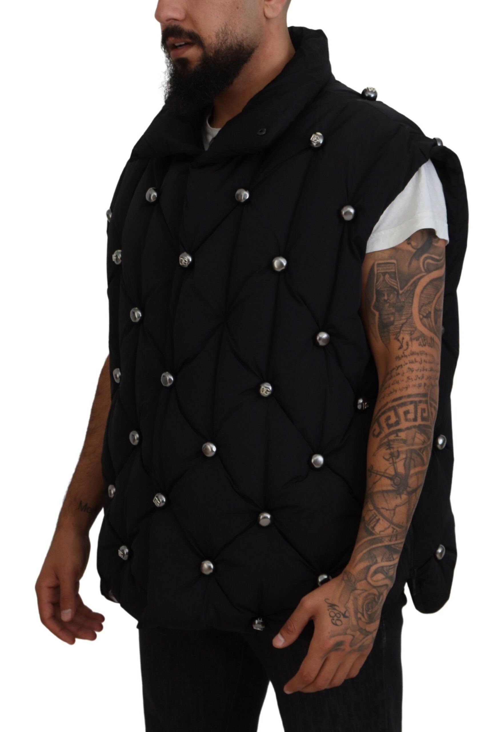 Black sleeveless Dolce & Gabbana metal-embellished jacket with sleek design and modern style.