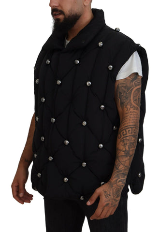Black sleeveless Dolce & Gabbana metal-embellished jacket with sleek design and modern style.