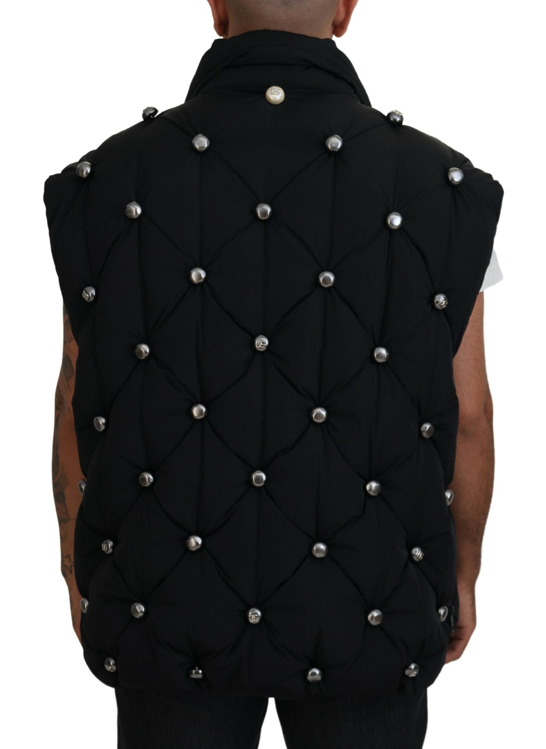 Black sleeveless Dolce & Gabbana metal-embellished jacket with a sleek design and stylish cut.