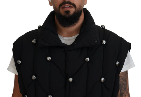 Black sleeveless Dolce & Gabbana metal-embellished jacket with modern design and sleek sleeveless fit.