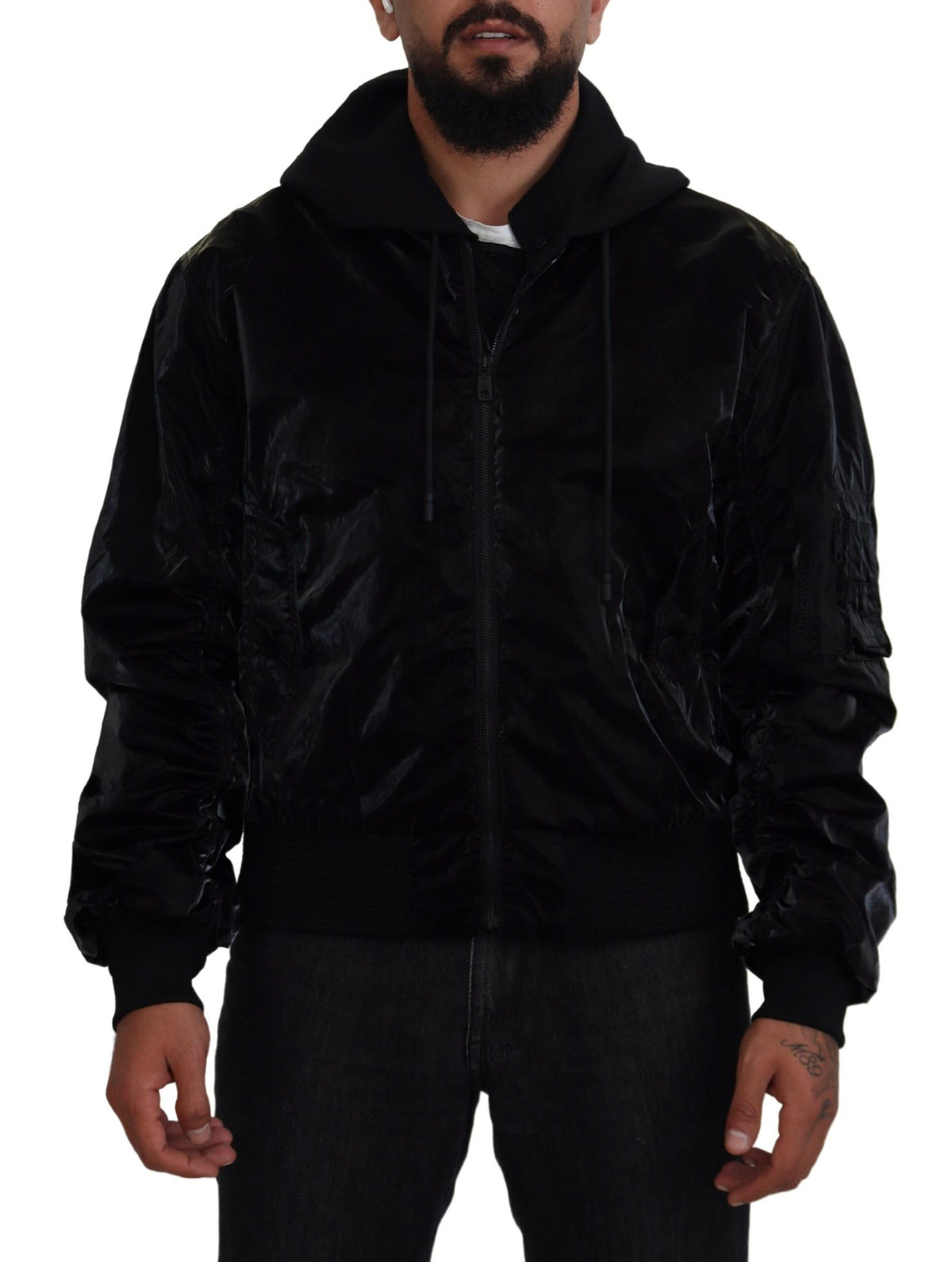 Dolce & Gabbana black nylon hooded full-zip bomber jacket displayed on a hanger.