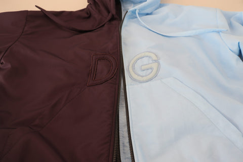 Black and blue Dolce & Gabbana hooded men's full-zip jacket with logo, casual style, and front pockets.