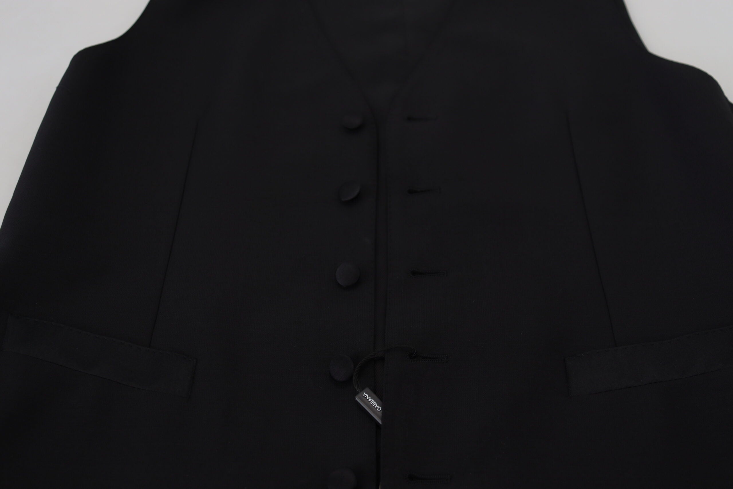 Black Virgin Wool Waistcoat Formal Vest by Dolce & Gabbana, tailored fit with lapel collar and button closure, suitable for elegant occasions.