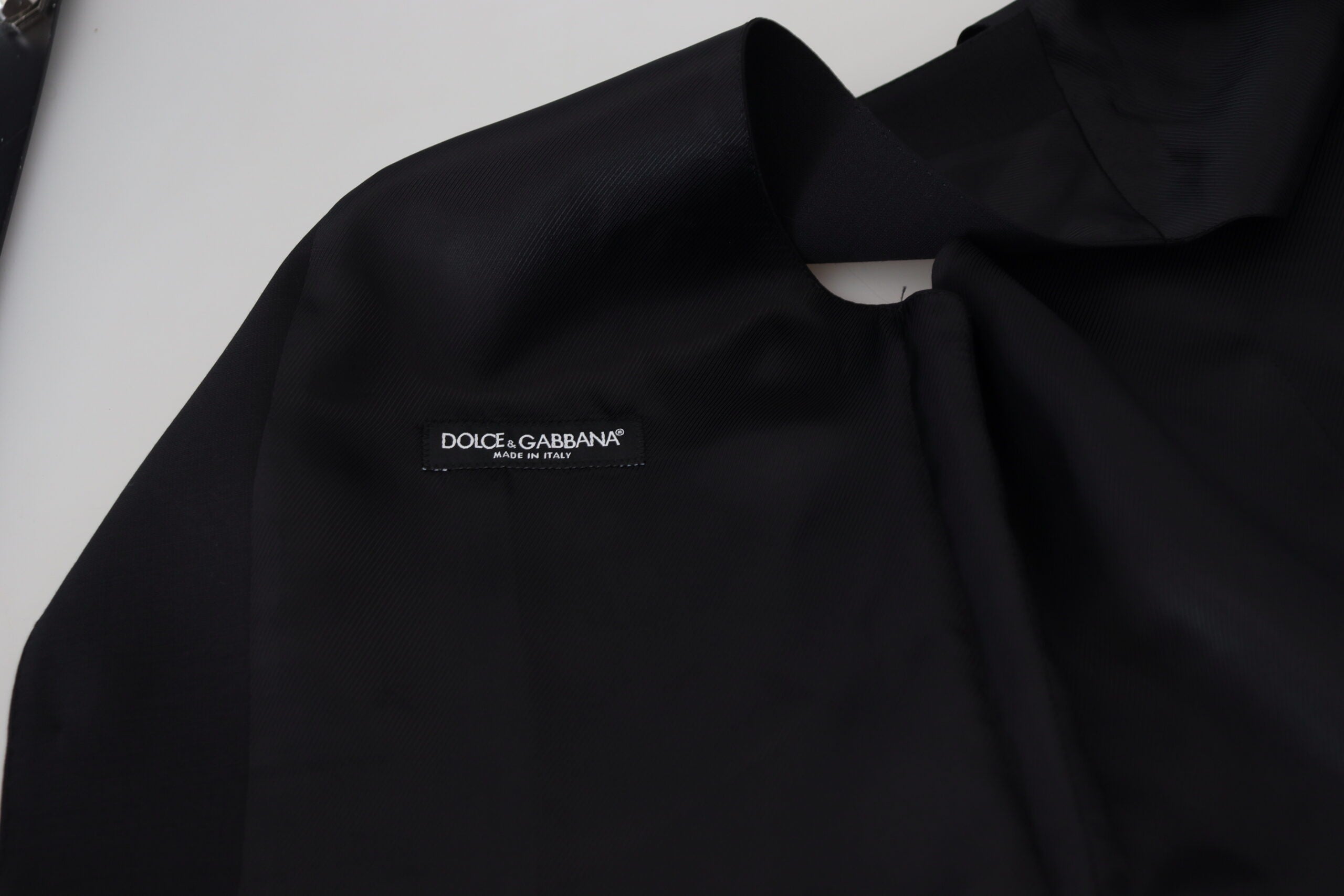 Black Virgin Wool Waistcoat by Dolce & Gabbana, formal vest with tailored fit, featuring classic lapels and sleek design.