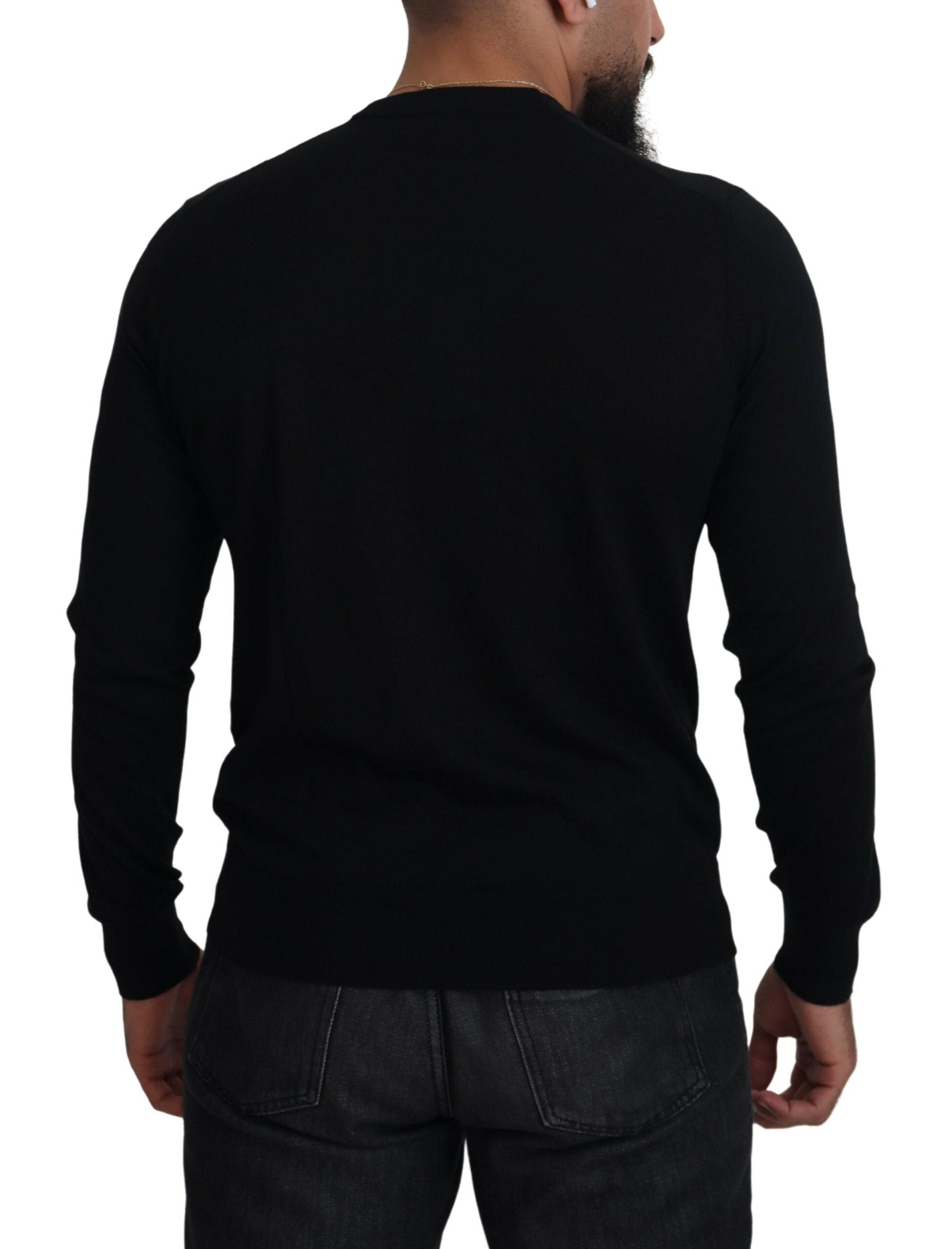 Black cashmere button-down cardigan sweater by Dolce & Gabbana, featuring a soft knit texture and classic design.