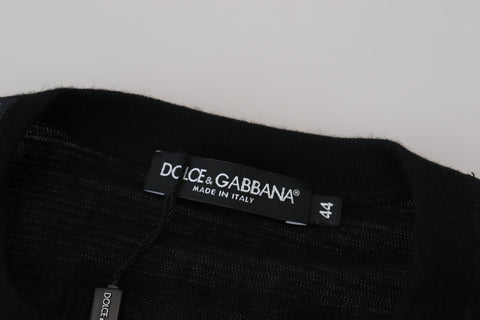Black cashmere button pullover sweater by Dolce & Gabbana, featuring a classic crewneck and button details.