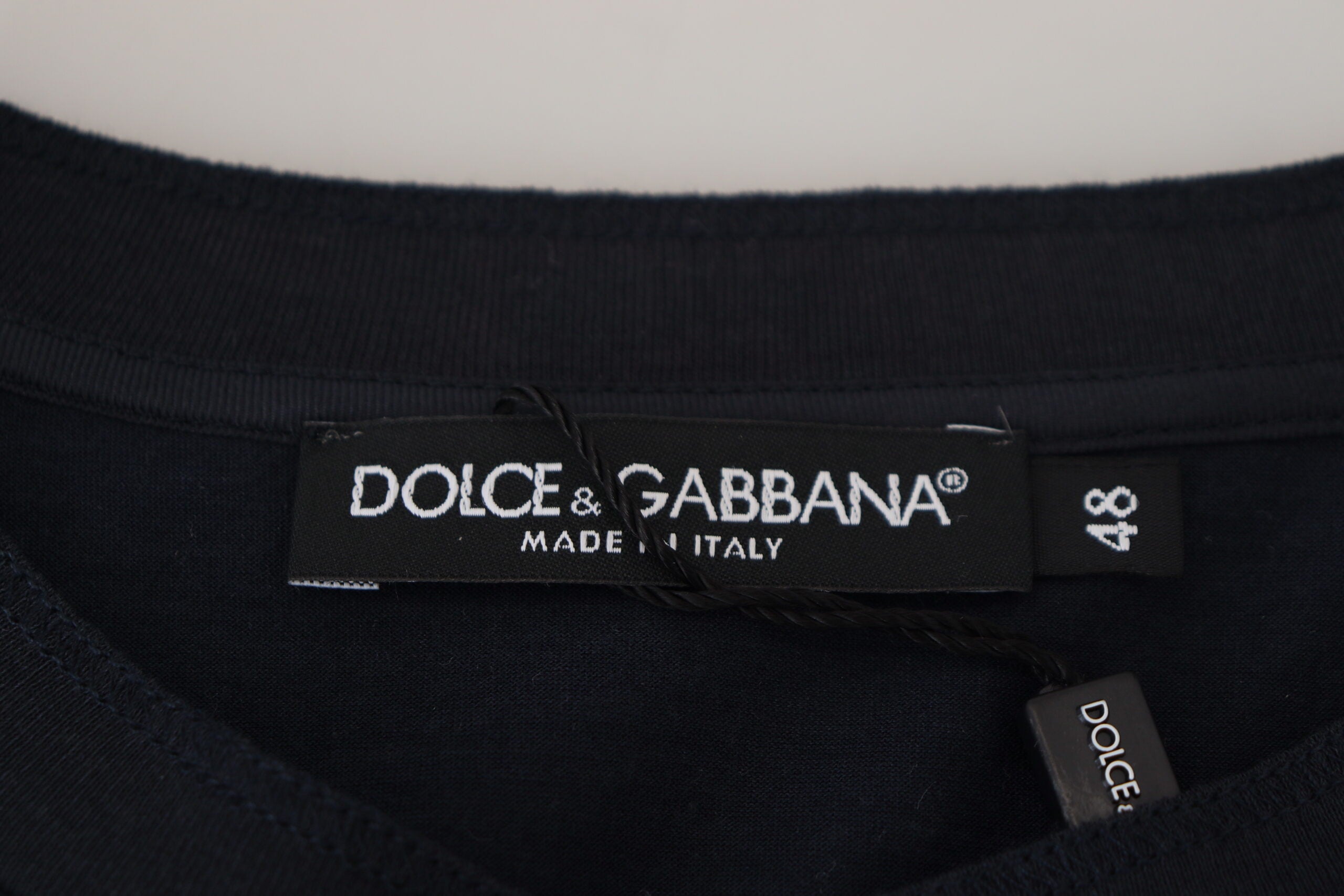 Blue cotton Dolce & Gabbana button crewneck pullover sweater with long sleeves and ribbed cuffs.