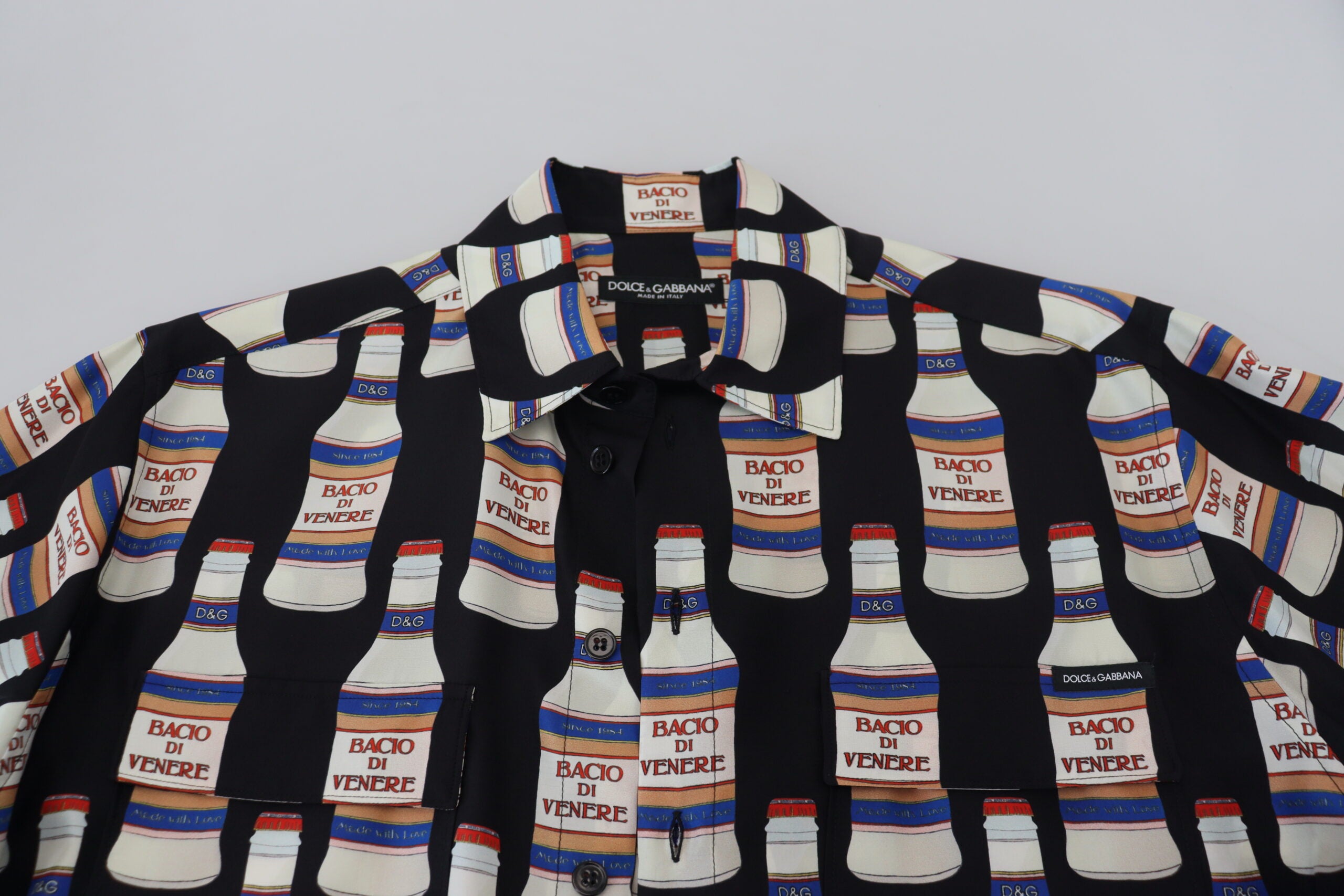 Black silk printed collared men's casual shirt by Dolce & Gabbana, featuring a stylish design and button-up front.