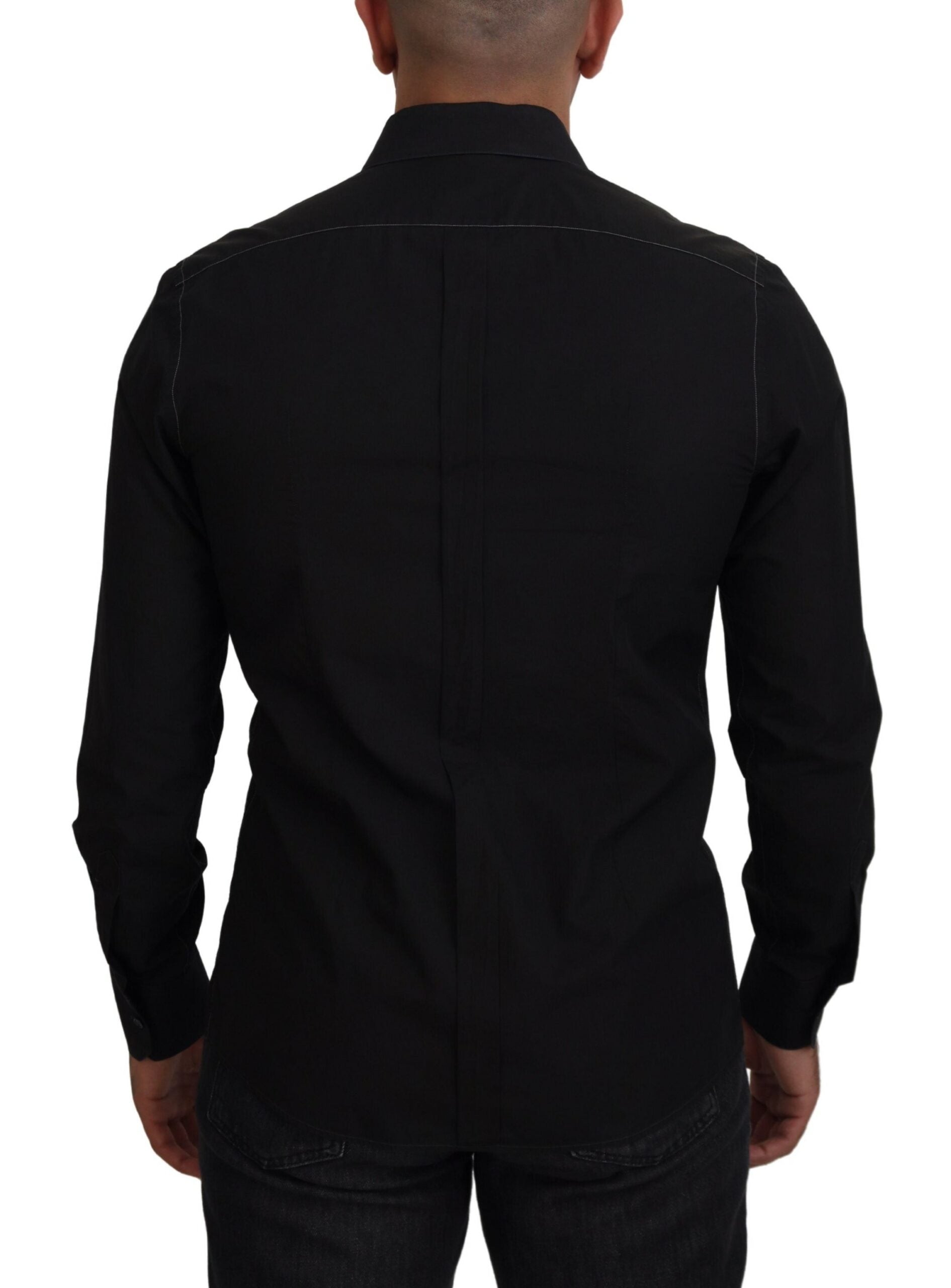 Black cotton collared long sleeve shirt by Dolce & Gabbana, featuring gold accents and classic design, displayed on a hanger.