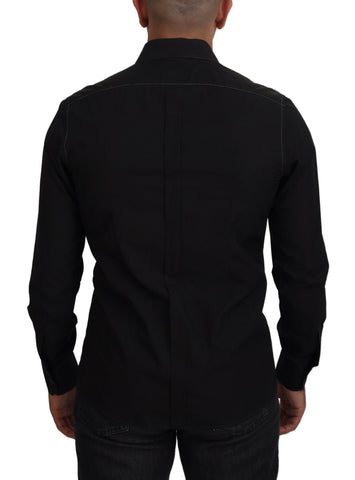 Black cotton collared long sleeve shirt by Dolce & Gabbana, featuring gold accents and classic design, displayed on a hanger.