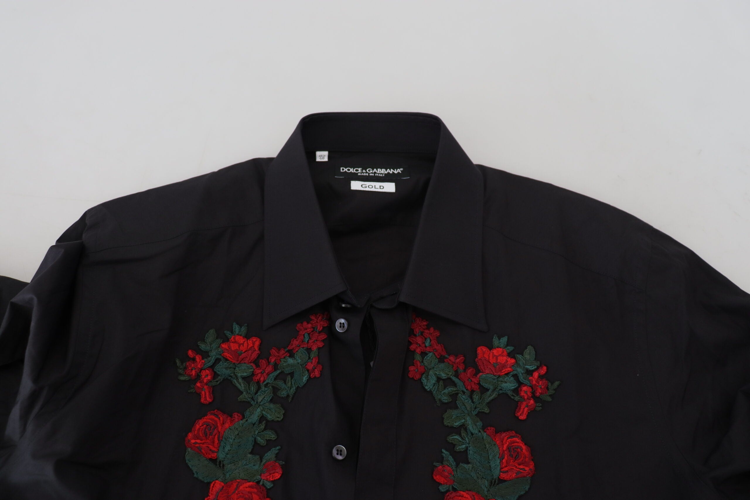 Black long sleeve men's shirt with gold floral embroidery by Dolce & Gabbana, featuring intricate floral detailing.