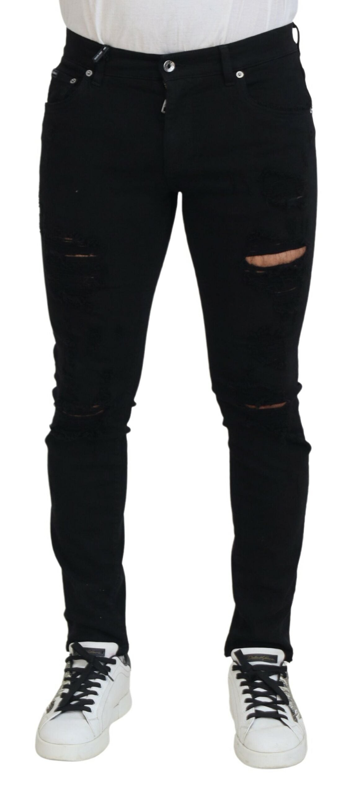 Black slim fit tattered denim cotton jeans by Dolce & Gabbana, showcasing distressed details and modern fit.