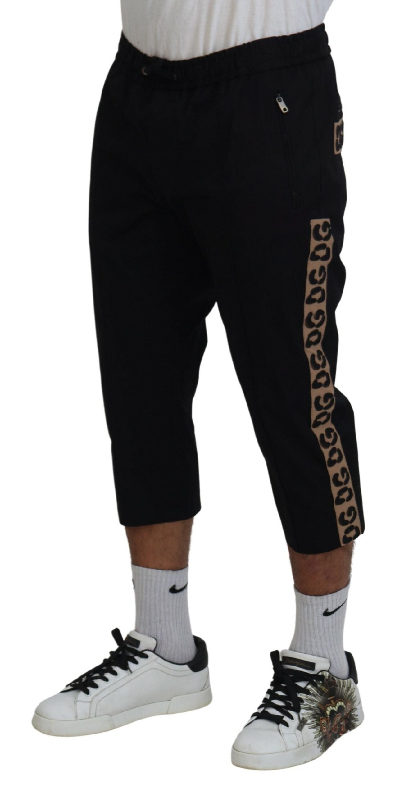 Black cotton elastic waist cropped pants with Dolce & Gabbana DG logo, featuring a relaxed fit and stylish design.