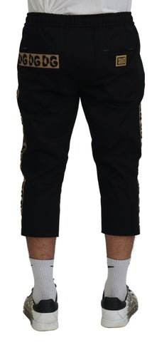 Black cotton elastic waist cropped pants with Dolce & Gabbana DG logo detail, stylish and comfortable for casual wear.