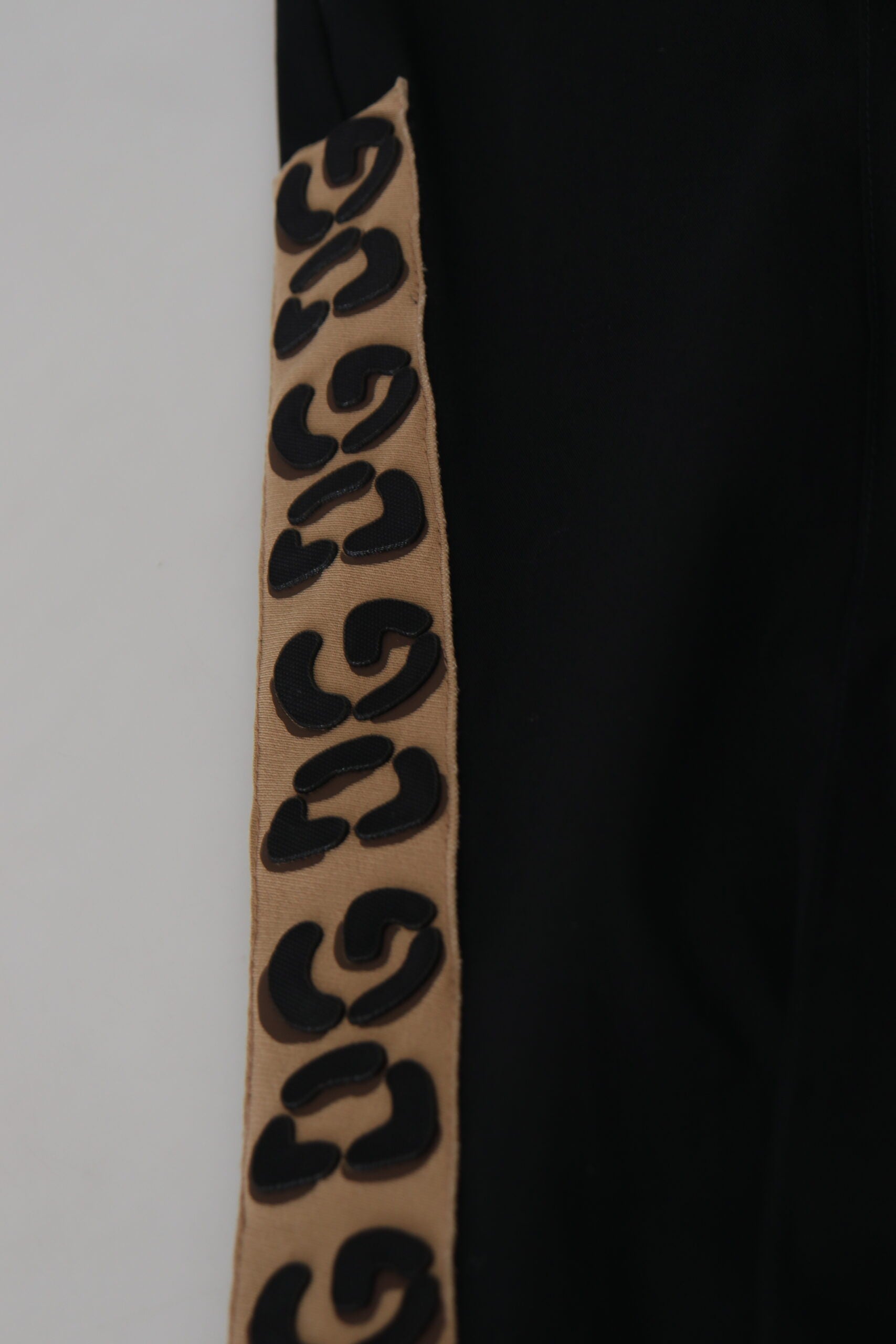 Black cotton elastic waist Dolce & Gabbana cropped pants with DG logo, showcasing a relaxed fit and stylish design.